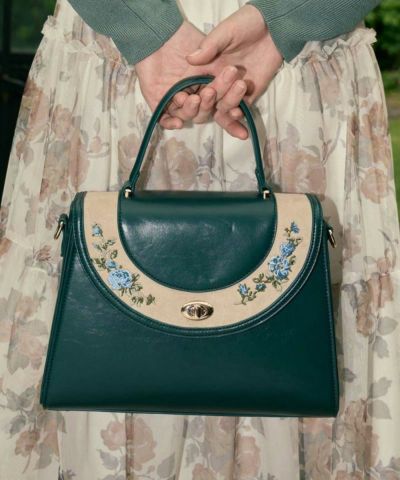 Circle flap embroidered trapezoid bag / an another angelus [55BC05a003]